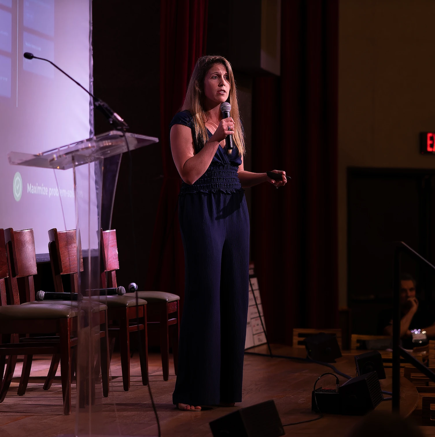 Maddie Bell speaking on stage